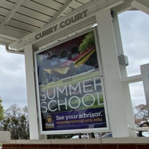 Links to Bus shelter advertisement page. Bus shelter with advertisement displayed.